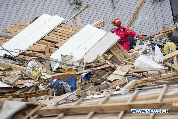 A member of the Chinese International Search and Rescue Team (CISAR) works at the quake-shaken Ofunato city in Iwate prefecture, Japan, March 15, 2011. 