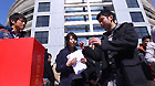 Students of the prestigious Tsinghua University donate money for quake-hit Japan in Beijing, capital of China, March 15, 2011.