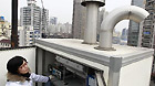 A staff member manipulates the equipment for checking the radiation level at an environment supervision station in Shanghai, east China, March 15, 2011.