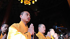 Members of Buddhist Association of China pray for the lost lives during the earthquake that took place in Japan last week in Beijing, capital of China, March 16, 2011.
