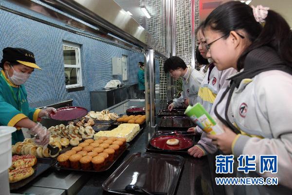 Students purchase food at Beijing No. 2 Middle School&apos;s new underground student canteen on Thursday, March 17, 2011. 
