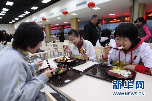 Students eat at Beijing No. 2 Middle School&apos;s new underground student canteen on Thursday, March 17, 2011. 