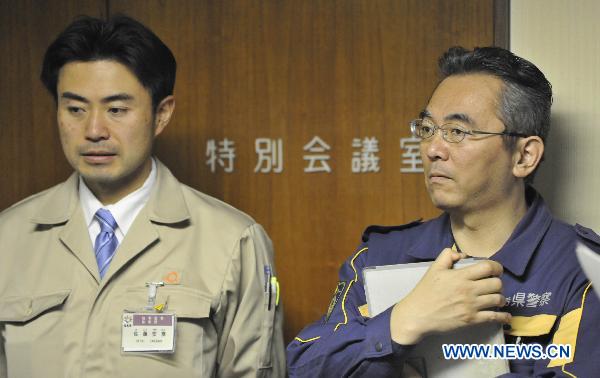 Regional supervisors attend an emergency meeting at the disaster countermeasures unit in Fukushima, March 19, 2011. 