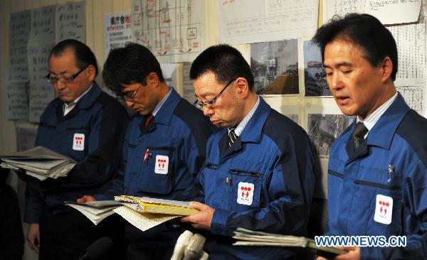 Experts of Tokyo Electric Power Co. (TEPCO) attend a press conference held by TEPCO at the disaster countermeasures unit in Fukushima, Japan, March 19, 2011. 