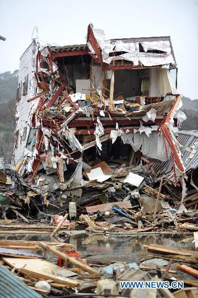 A destroyed house stands among debris from the March 11 tsunami and earthquake in the city of Kesennuma in Miyagi prefecture, Japan, on March 20, 2011. 