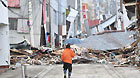 A men walks among the debris from the March 11 tsunami and earthquake in the city of Kesennuma in Miyagi prefecture, Japan, on March 20, 2011.