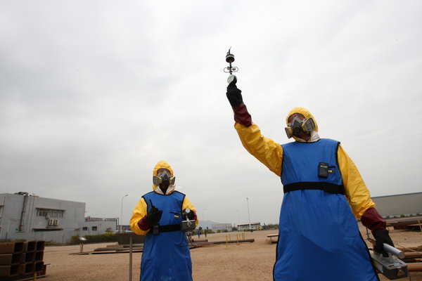 People take part in a nuclear leakage emergency drill at Gaolangang district after after nuclear leakage in Japan on March 17, 2011 in Zhuhai, Guanghzou Province of China. 