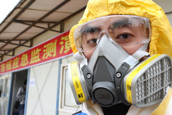 People take part in a nuclear leakage emergency drill at Gaolangang district after after nuclear leakage in Japan on March 17, 2011 in Zhuhai, Guanghzou Province of China.