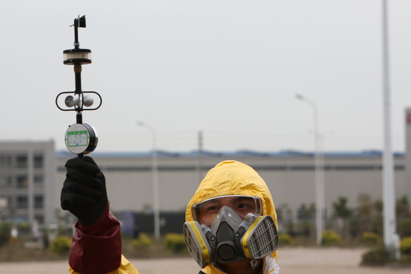 People take part in a nuclear leakage emergency drill at Gaolangang district after after nuclear leakage in Japan on March 17, 2011 in Zhuhai, Guanghzou Province of China. 