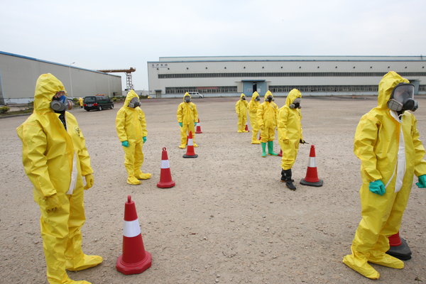 People take part in a nuclear leakage emergency drill at Gaolangang district after after nuclear leakage in Japan on March 17, 2011 in Zhuhai, Guanghzou Province of China. 