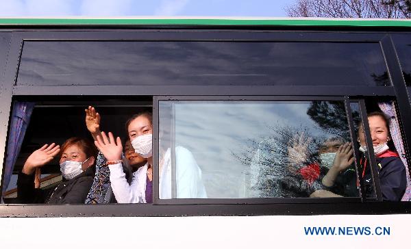 Chinese evacuees are seen in a bus to airport before flying back to China in Niigata, Japan, March 20, 2011. 