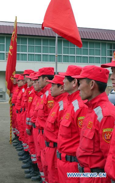 Members of Chinese rescue team attend a farewell ceremony in Ofunato, Iwate Prefecture, Japan, March 20, 2011. 