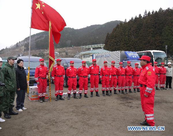 Yin Guanghui (Front), head of Chinese rescue team, attends a farewell ceremony in Ofunato, Iwate Prefecture, Japan, March 20, 2011. 