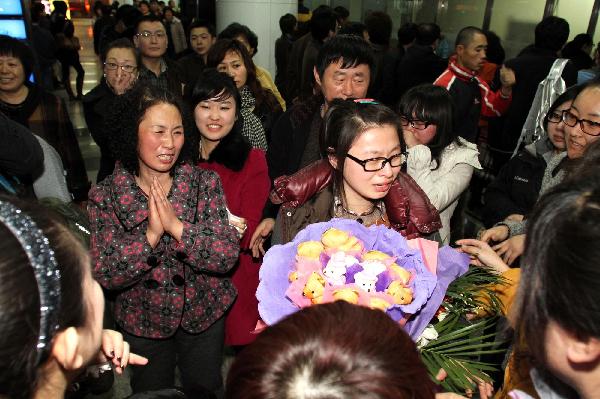 Trainees of China Dalian International Cooperation (Group) Holdings Ltd. arrive in Dalian, northeast China&apos;s Liaoning Province, March 19, 2011.