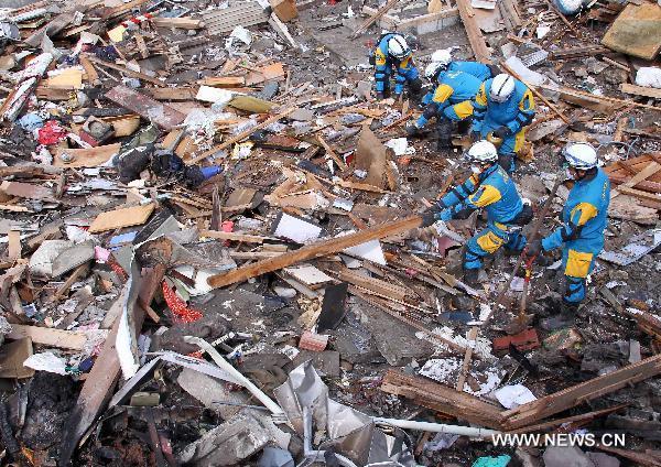 Policemen from Kannagawa Prefecture search for survivors in quake-devastated Iwate Prefecture, Japan, on March 22, 2011. 