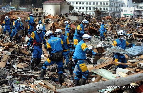 Rescue workers search for survivors in quake-devastated Iwate Prefecture, Japan, on March 22, 2011. 