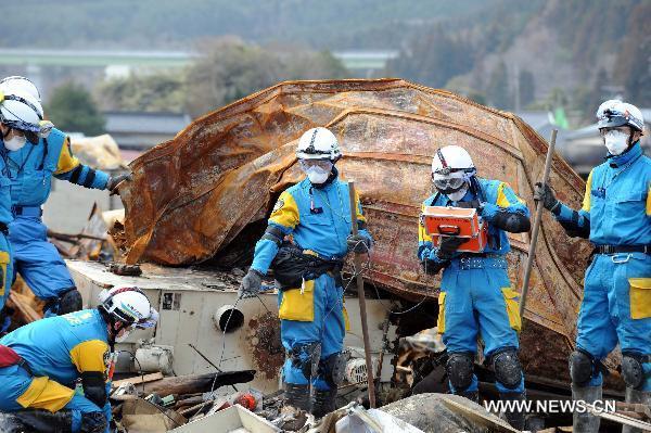 Rescue workers search for survivors in quake-devastated Iwate Prefecture, Japan, on March 22, 2011. 