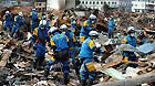 Rescue workers search for survivors in quake-devastated Iwate Prefecture, Japan, on March 22, 2011.