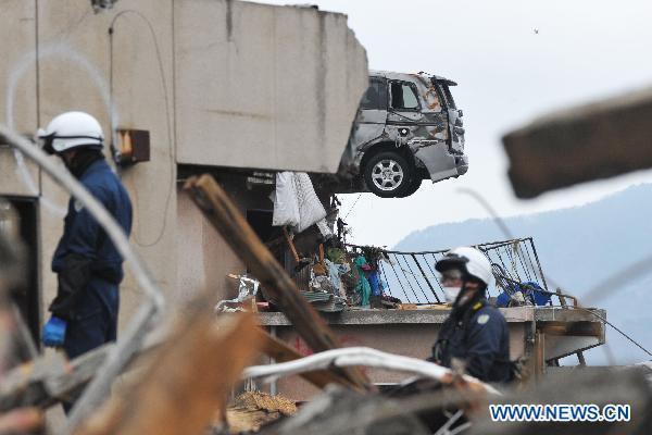 Rescuers work in quake-devastated Iwate Prefecture, Japan, on March 21, 2011.