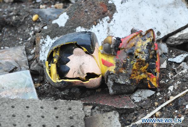 A porcelain doll is seen destroyed and burned in the devastating quake and tsunami in Iwate Prefecture, Japan, on March 21, 2011.