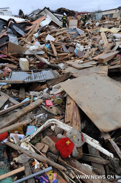 Photo taken on March 21, 2011, shows building debris in Kesennuma, Miyagi-ken in Japan. 