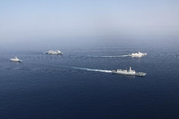 Chinese Navy's seventh batch of escort flotilla and eighth batch of escort flotilla travel during a ceremony for farewell navigation in Gulf of Aden, March 22, 2011.