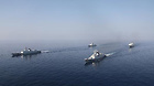 Chinese Navy's seventh batch of escort flotilla and eighth batch of escort flotilla travel during a ceremony for farewell navigation in Gulf of Aden, March 22, 2011.