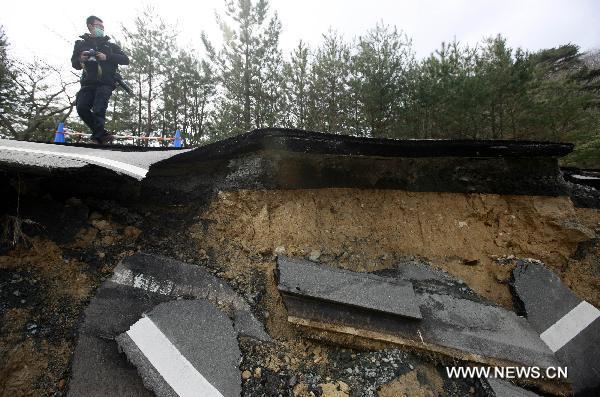 A road is severely damaged in Oshika Peninsula, Miyagi Prefecture, Japan, March 23, 2011. 
