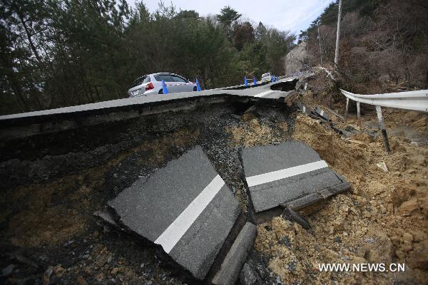 A road is severely damaged in Oshika Peninsula, Miyagi Prefecture, Japan, March 23, 2011.