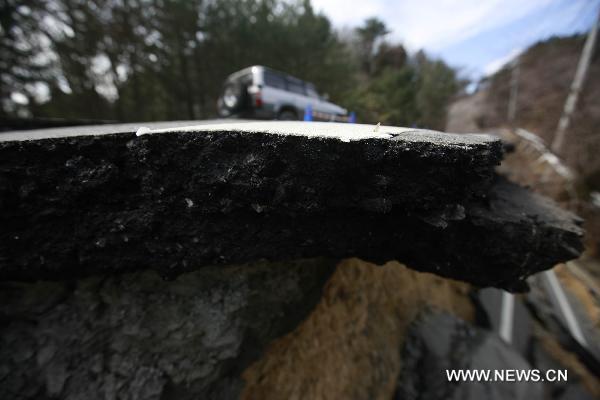 A road is severely damaged in Oshika Peninsula, Miyagi Prefecture, Japan, March 23, 2011.