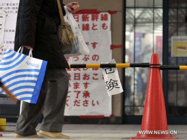 A person passes an alert area in Fukushima City, Japan, March 25, 2011. The city has been witnessing a change of people's life since the nuclear crisis broke out at the the crippled Fukushima Daiichi nuclear power plant after the earthquake. (Xinhua/Huang Xiaoyong) (yc) (Xinhua/Huang Xiaoyong) (yc) 