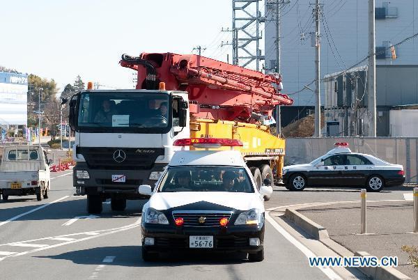 A Chinese-made pump truck is led to Fukushima Dai-Ichi nuclear power plant, in Japan, March 27, 2011.
