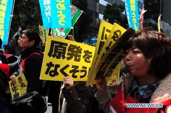 Protesters shout slogans during an anti-nuclear march in Tokyo, Japan, March 31, 2011.