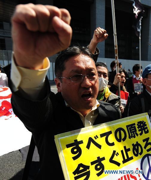 A protester shouts slogans during an anti-nuclear march in Tokyo, Japan, March 31, 2011.