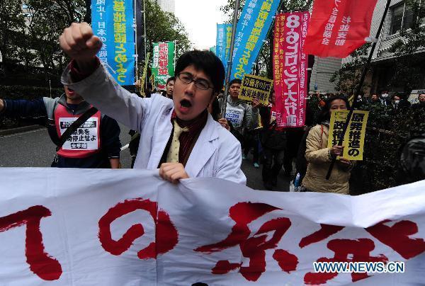 A protester shouts slogans during an anti-nuclear march in Tokyo, Japan, March 31, 2011.