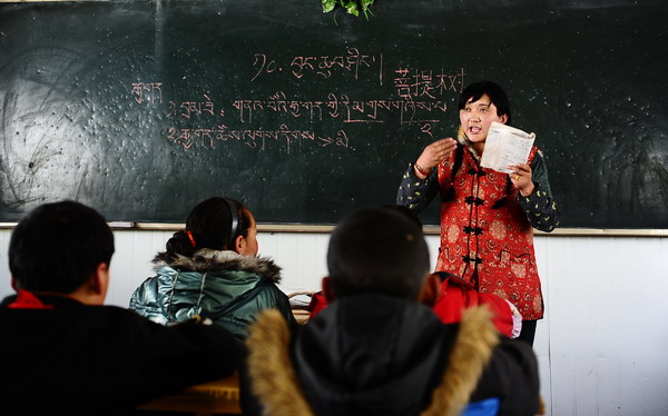 Cai Songmao, a Tibetan language teacher, gives lessons at a primary school in Yushu, April 13, 2011. 