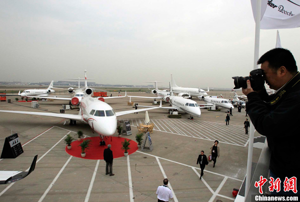 Corporate aircraft are displayed at the new business terminal at Shanghai&apos;s Hongqiao airport, as part of the Shanghai International Business Aviation Show (SIBAS), which opened April 13, 2011. 