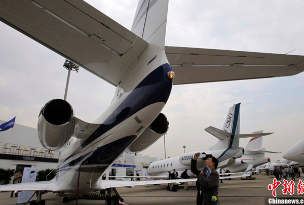 Corporate aircraft are displayed at the new business terminal at Shanghai&apos;s Hongqiao airport, as part of the Shanghai International Business Aviation Show (SIBAS), which opened April 13, 2011. 