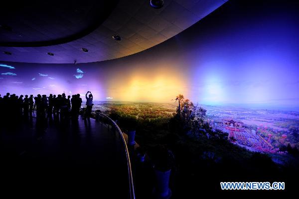 Visitors view the panoramic painting entitled Splendid Central Plains in Zhengzhou, central China's Henan Province, April 26, 2011.