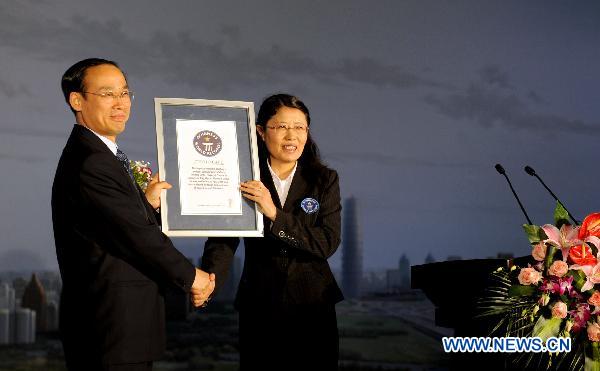 The Guinness Certificate of the painting entitled Splendid Central Plains is displayed in Zhengzhou, central China's Henan Province, April 26, 2011.