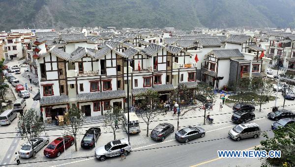 Photo taken on April 30, 2011 shows that the autos of the visitors parking in the streets of the rebuilt Yingxiu Town of southwest China's Sichuan Province. 