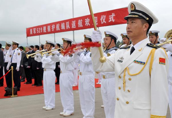 Members of military band perform during a welcome ceremony for the return of Chinese Navy Seventh Escort Task Force in Zhoushan, east China&apos;s Zhejiang Province, May 9, 2011.