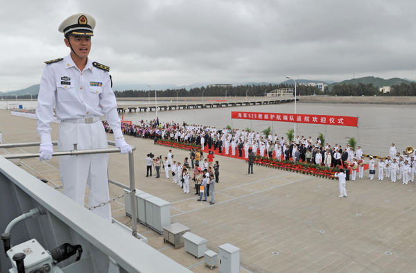 Captain of frigate Zhoushan Yang Liming is seen commanding on board as the ship approaches its berth in Zhoushan, east China&apos;s Zhejiang Province, May 9, 2011. 