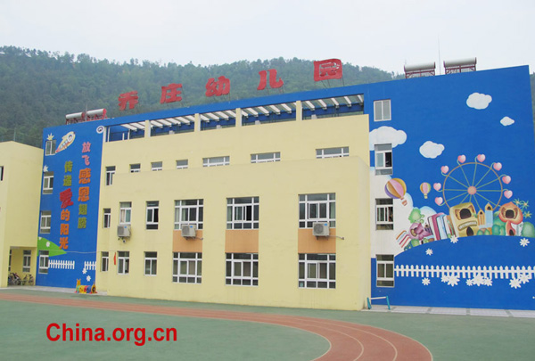 New buildings are seen in Bailu Primary School in Pengzhou City, southwest China&apos;s Sichuan Province, in 2011. 