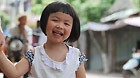 Chen Xingwen is on her way home from a kindergarten in Meishan, southwest China's Sichuan Province, May 10, 2011.