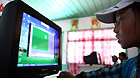 Zhaxizhoima, a pupil of Lhoba ethnic group, has computer class at school in Qionglin Village of Nanyi Lhoba Ethnic Township, in Mainling County of southwest China's Tibet Autonomous Region (TAR), May 11, 2011.