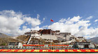 Photo taken on May 23, 2011 shows the flag-raising ceremony held at the Potala Palace Square in Lhasa, capital of southwest China's Tibet Autonomous Region.
