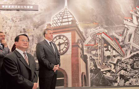 Foreign diplomats and other representatives visit an exhibition on Monday about reconstruction efforts following the devastating Wenchuan earthquake that hit Sichuan Province in May 2008. 