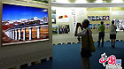 Citizens visit the exhibition marking the 60th anniversary of the Peaceful Liberation of Tibet in the Cultural Palace of Nationalities in Beijing.