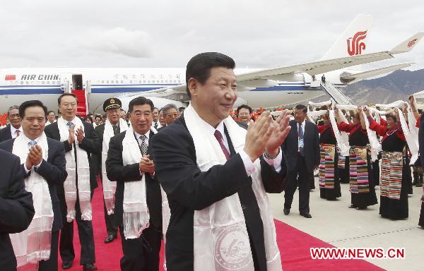 Chinese Vice President Xi Jinping (Front) is welcomed upon his arrival in Lhasa, capital of southwest China's Tibet Autonomous Region, on July 17, 2011. 